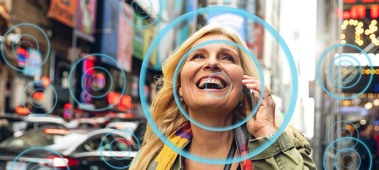 Screenshot of woman in street talking on mobile phone