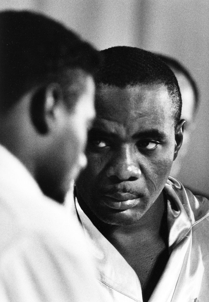 Heavyweight champ Sonny Liston glares at Floyd Patterson during the weigh-in for their second title bout in two years, Las Vegas, July 1963. The fight lasted a little more than two minutes, with Liston flooring Patterson three times in the first round.