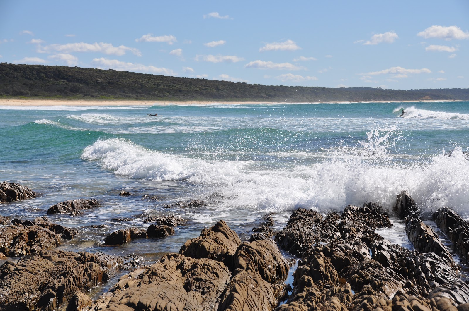 ocean waves hitting rocks narooma wagonga inlet australia beautiful beach