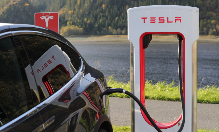 Tesla plugged into a charging station. 