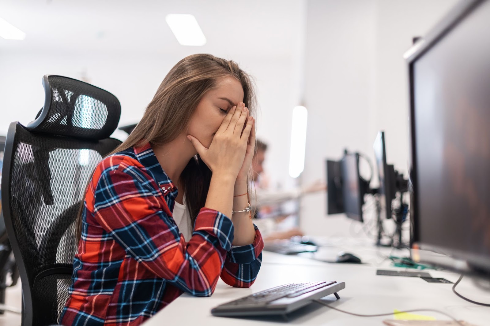 stressed-out-worker-at-her-workstation