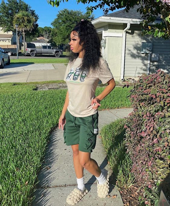 lady wearing white bubble shoes on a path