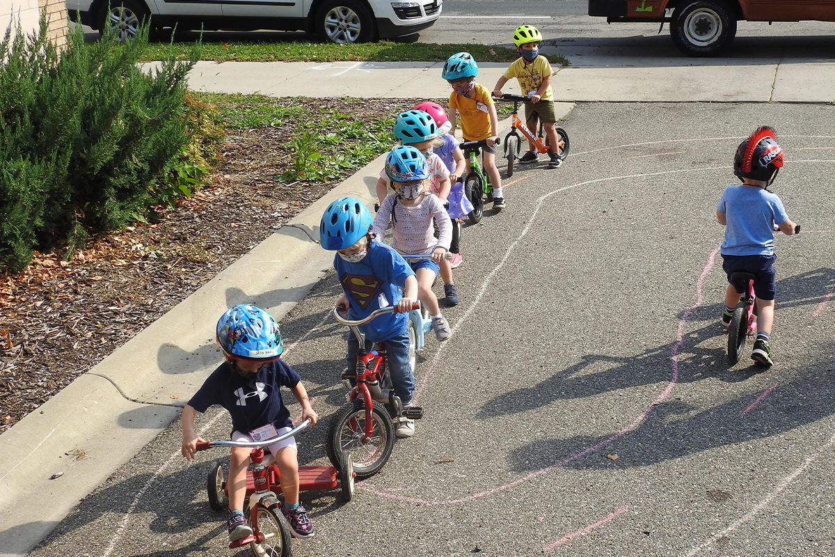 kids riding their bikes/trikes fro trike-a-thon week