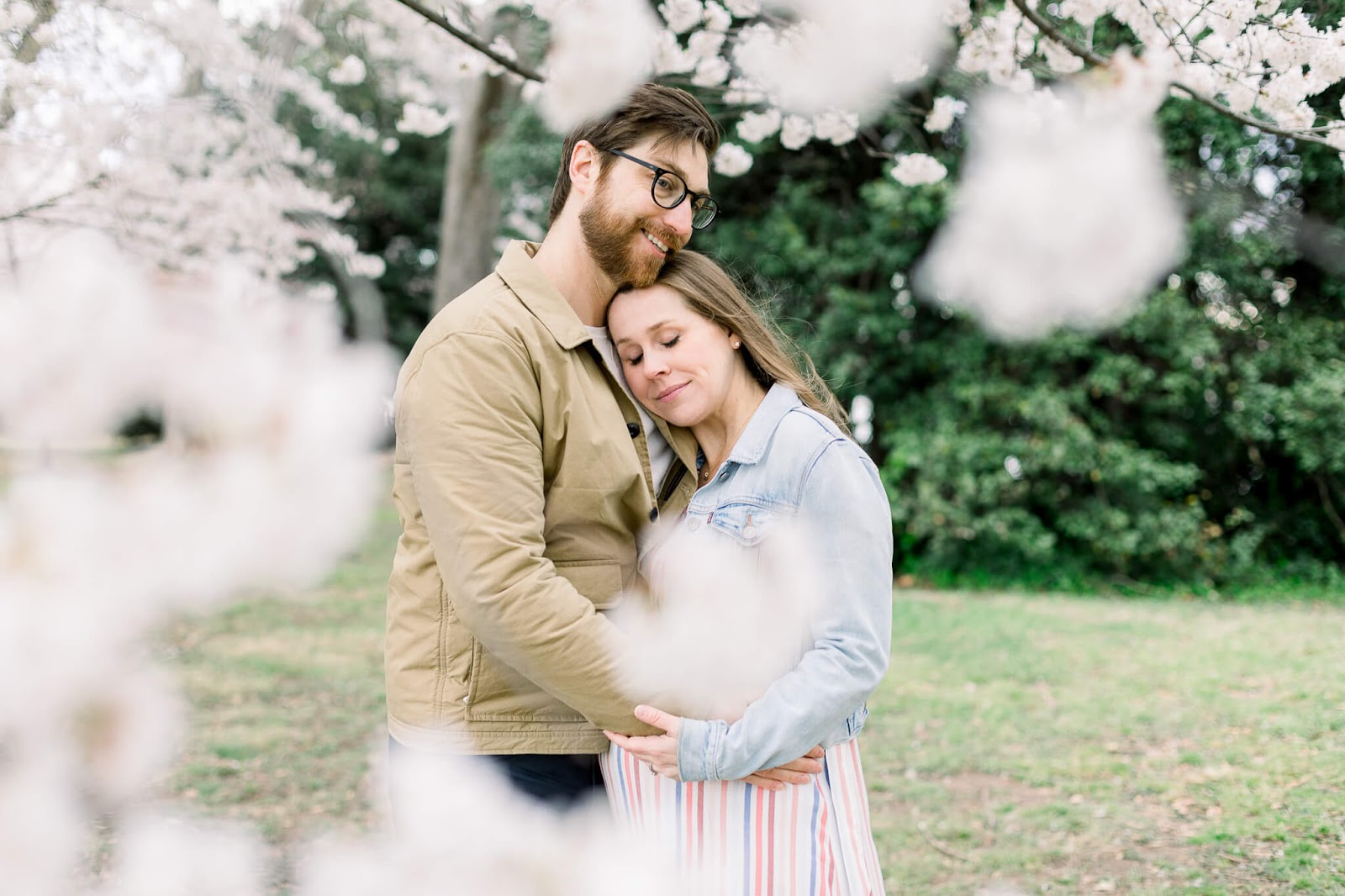 Pregnant couple embracing each other