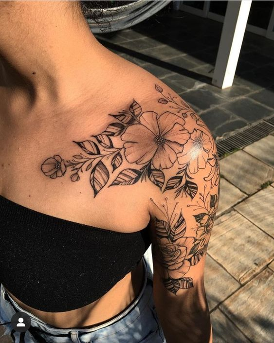 lady wearing plant tattoo on her shoulder to chest