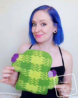 designer holding crochet cactus pillow