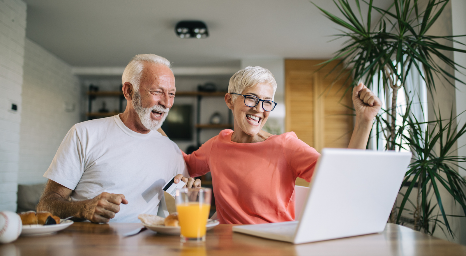 senior couple bidding on an online auction