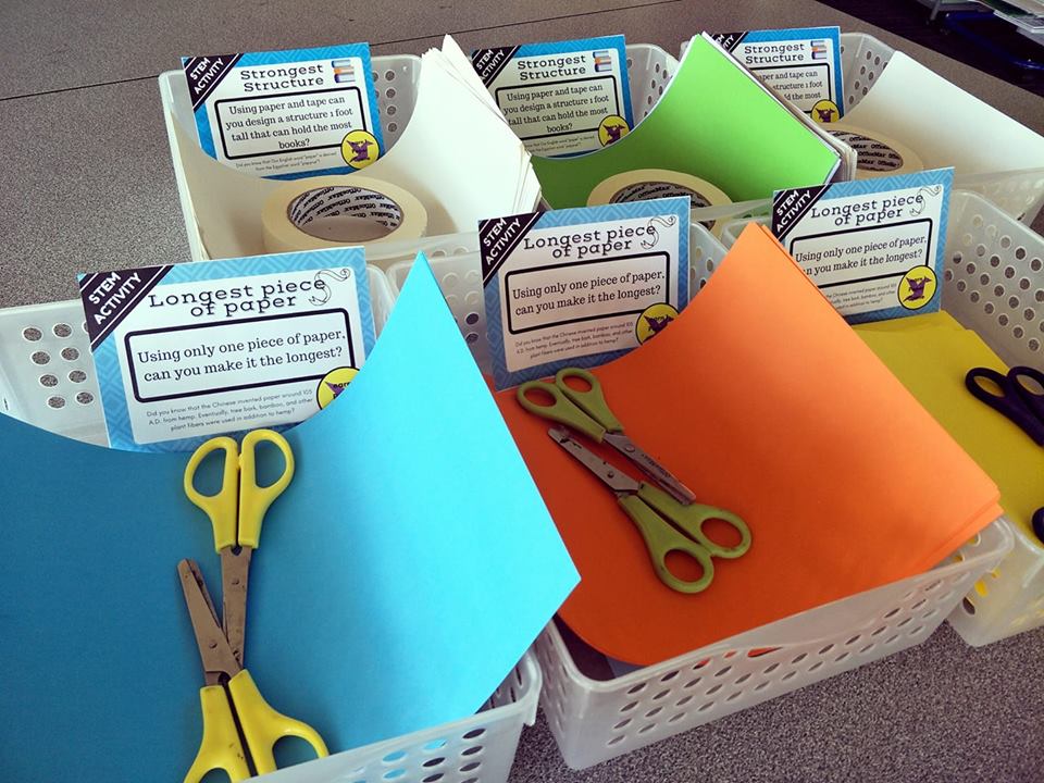 STEM activities in baskets with paper, scissors, tape and STEM task cards
