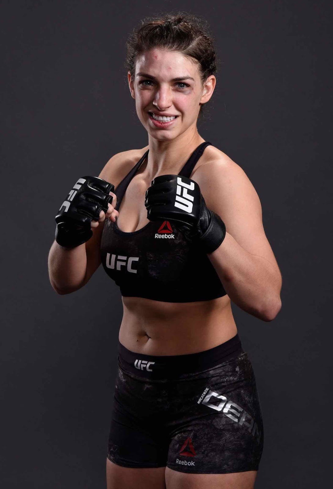 Mackenzie Dern in a fighting pose wearing UFC gloves