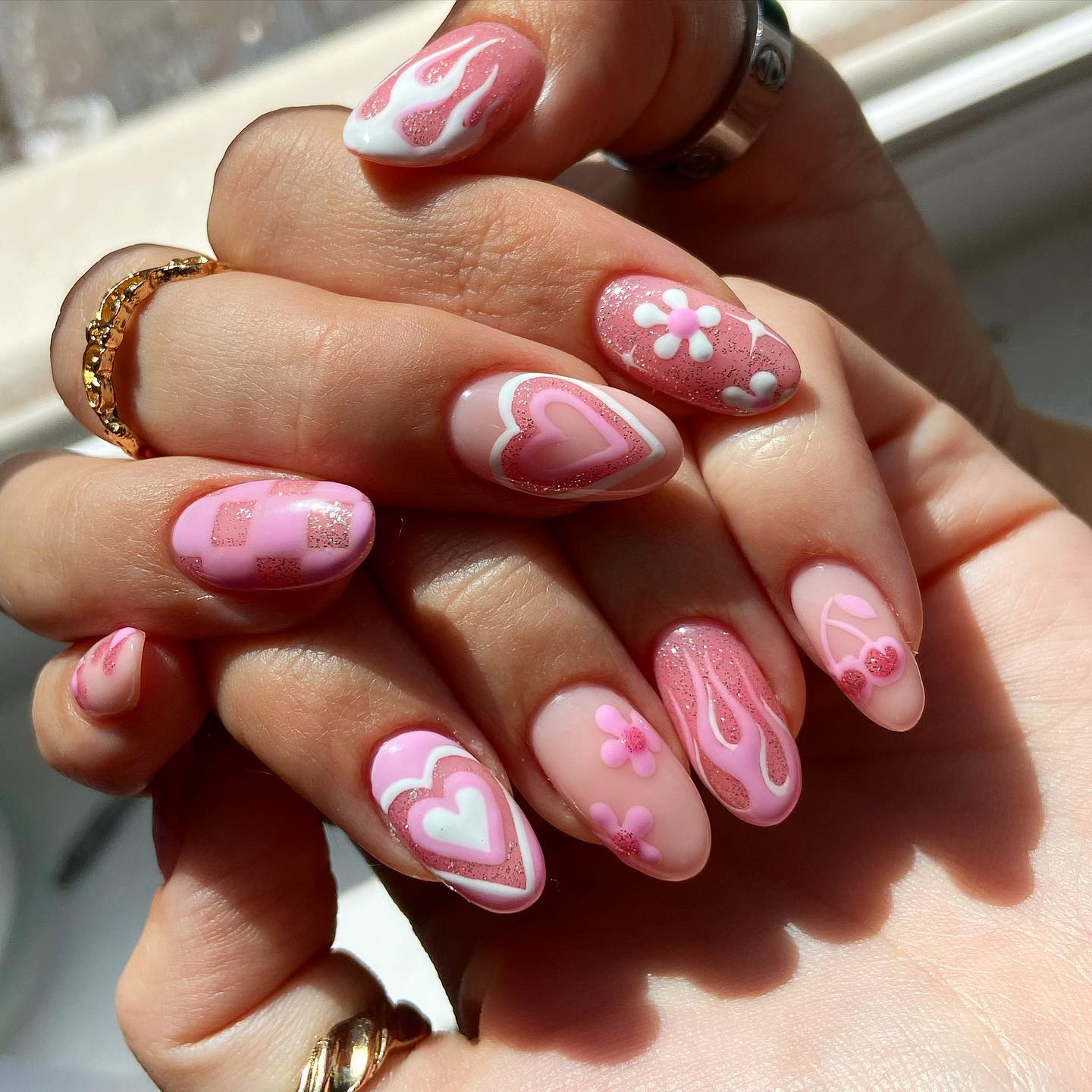 Light pink manicure with white heart design
