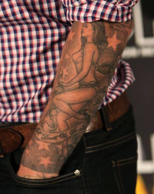 David Beckham's tattoo of Victoria on his left forearm.