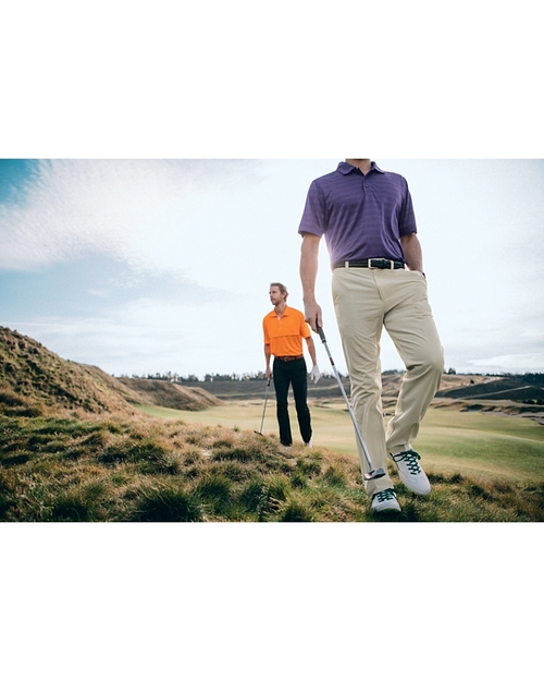 Man Wearing The Bainbridge Flat Front Pant On A Golf Course
