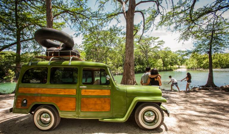 A family is enjoying a day by the water at Camp Huaco Springs in New Braunfels, Texas. 