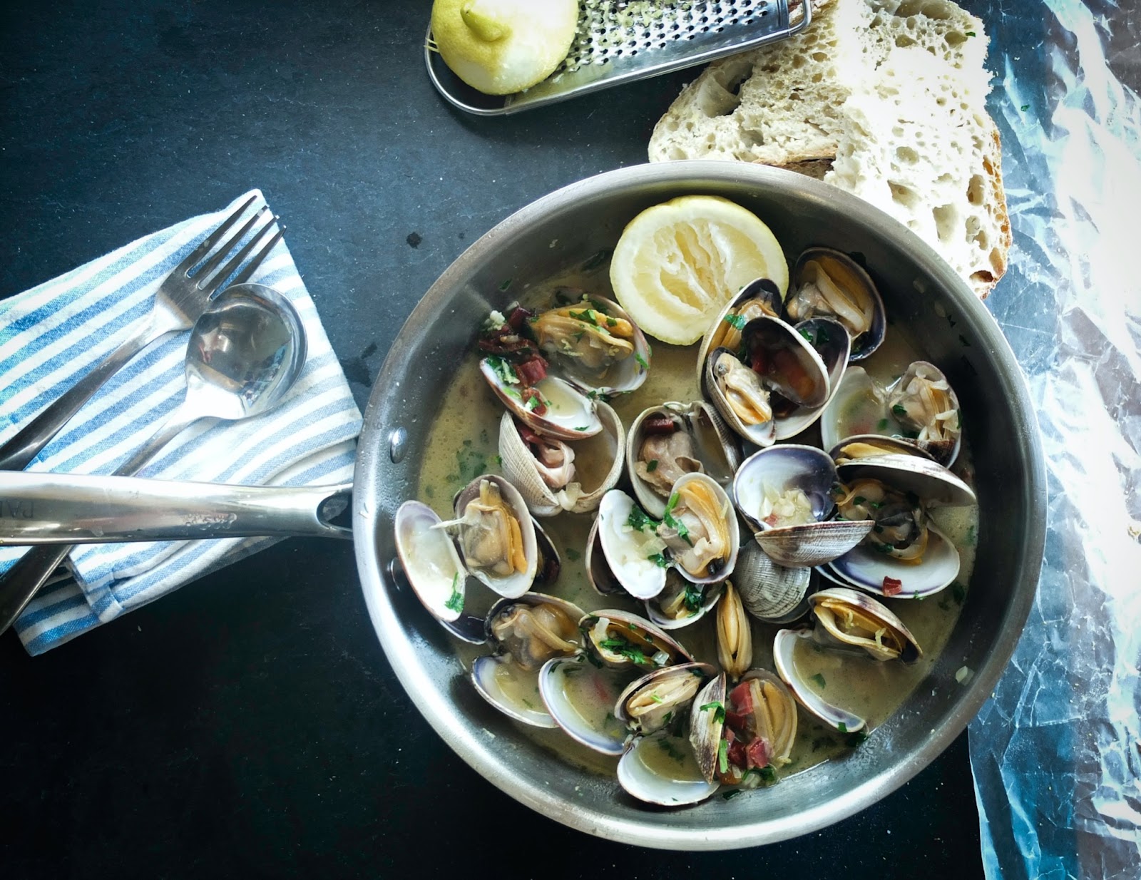 Pot of cooked shellfish with lemon