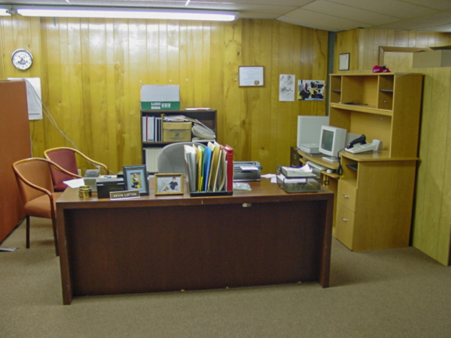 A desk in an open office. 