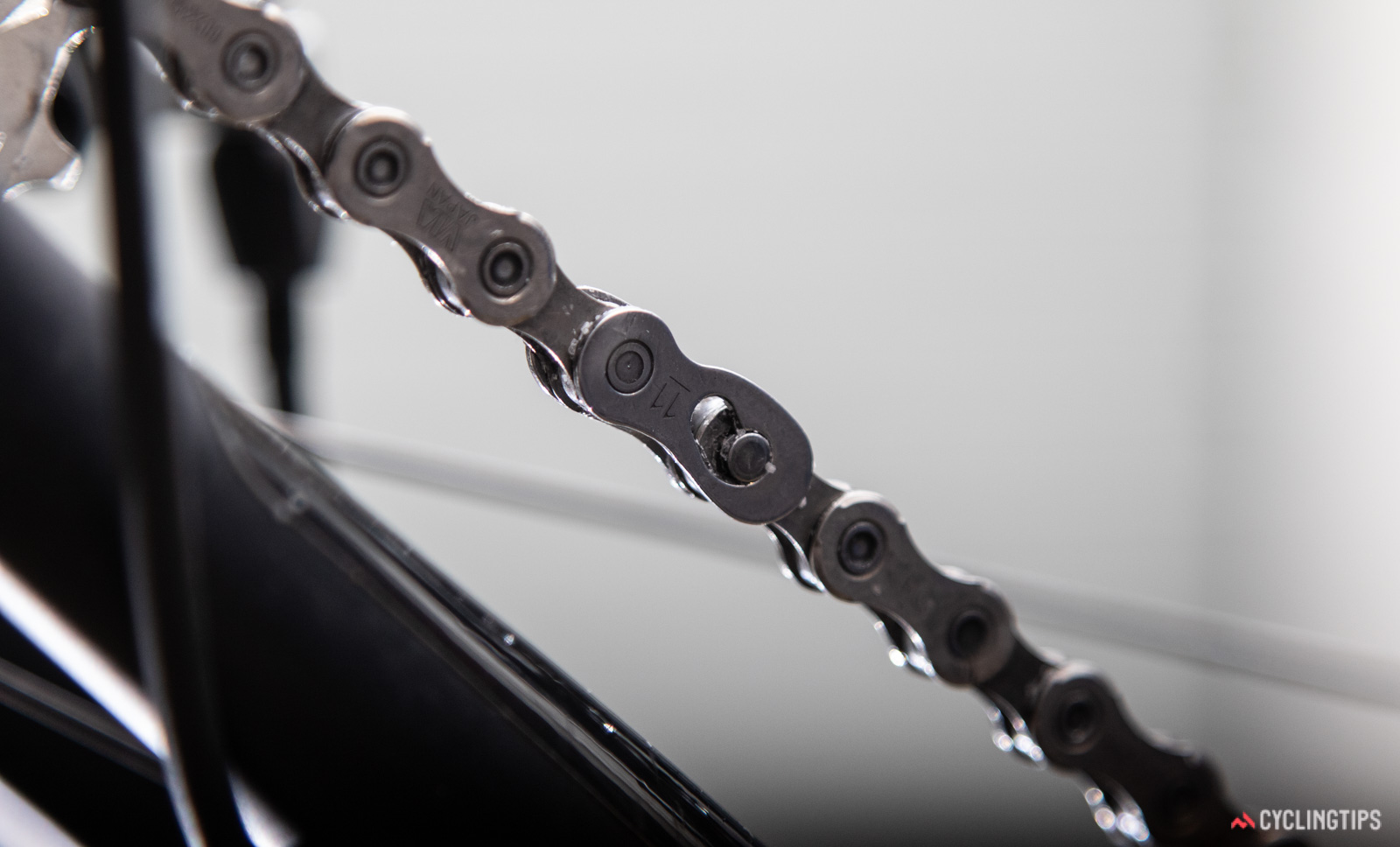 Your chain is connected by way of a quick link or a joining pin which is where you need to undo it.