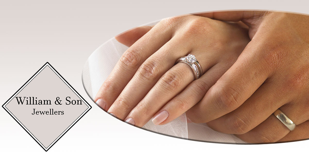 William & Son Jewellers logo with a photo of a couple holding hands while wearing wedding bands