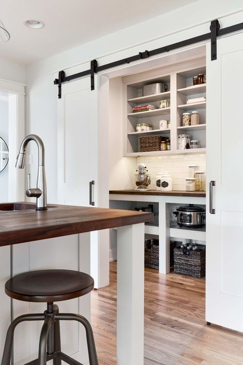 white farmhouse pantry with sliding doors, diy pantry ideas storage space with white shelving