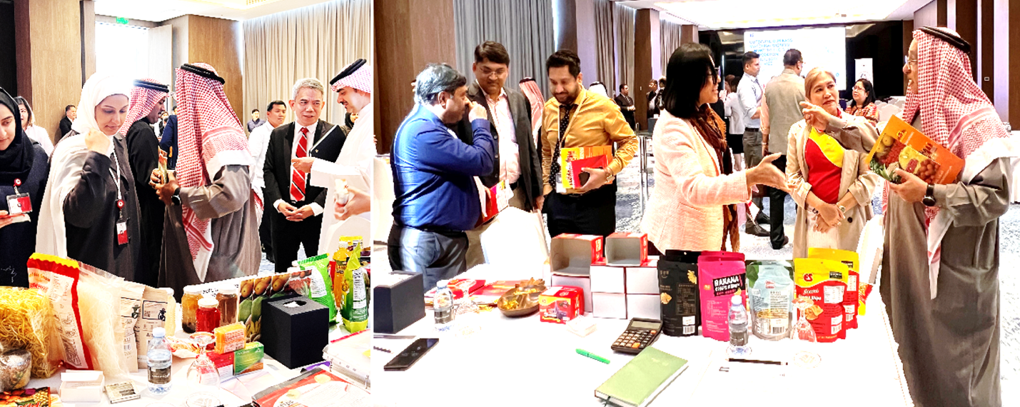 A group of people standing around a table with food and drinks

Description automatically generated with medium confidence