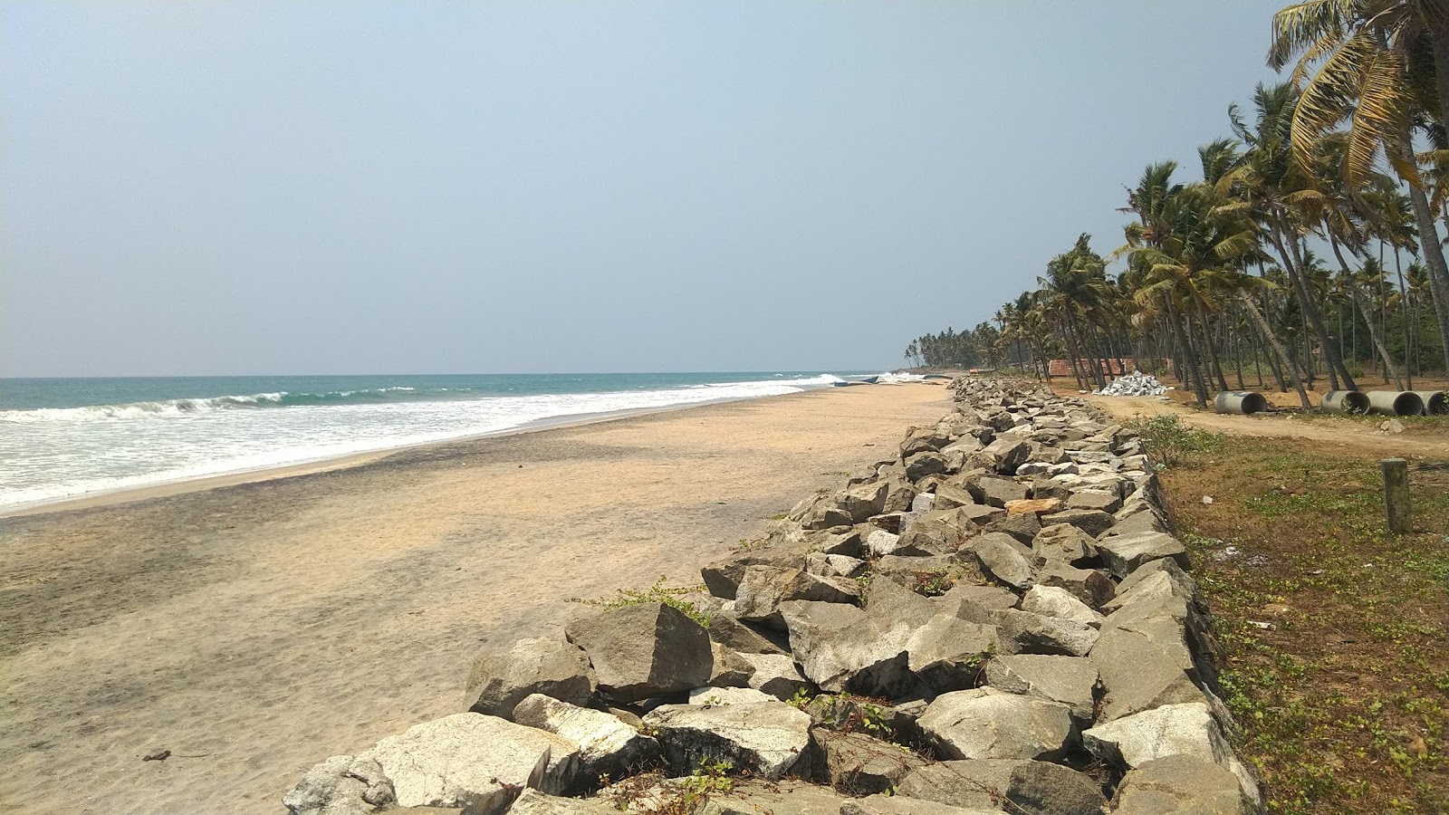Foto av Paravur Beach med fin beige sand yta