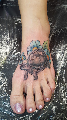 Explore aries ram tattoo ideas, creative tattoo ideas in Elizabeth City, available at Wolfs Den Custom Tattoo & Body Piercing Studio