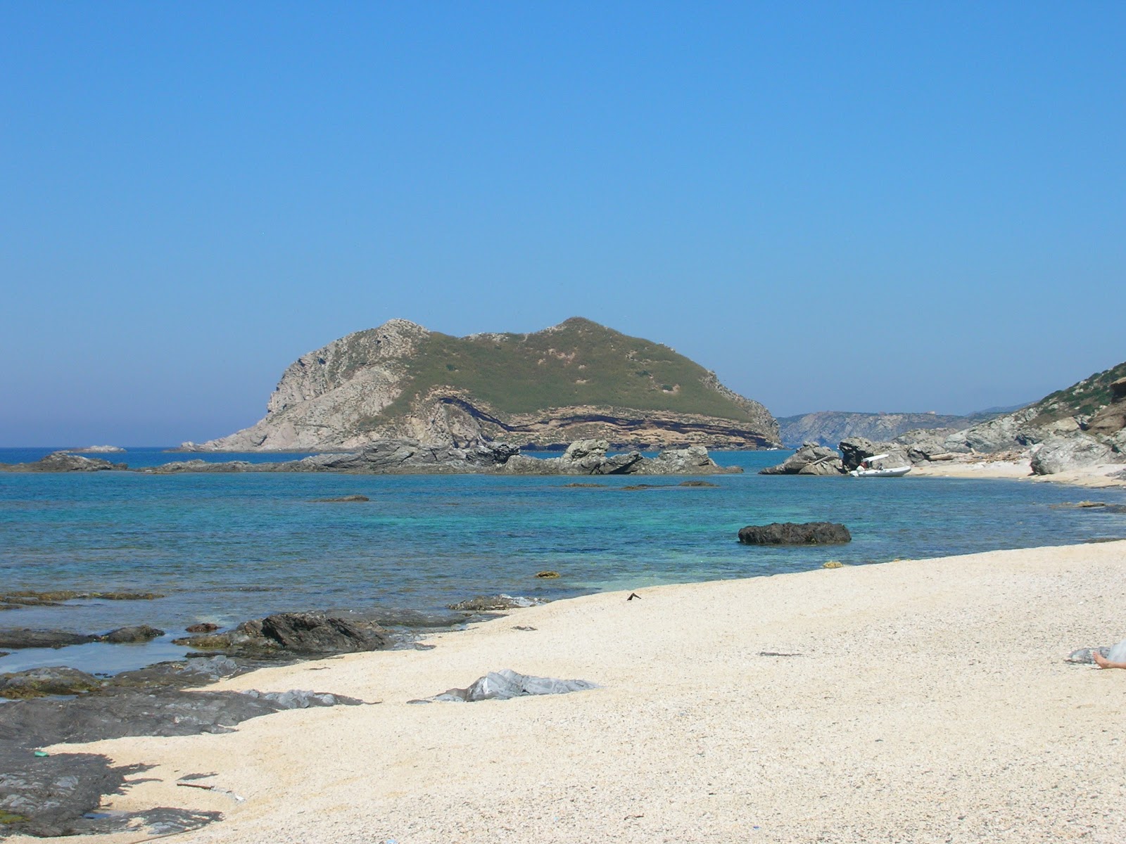 Photo of Cala Puntello with turquoise pure water surface