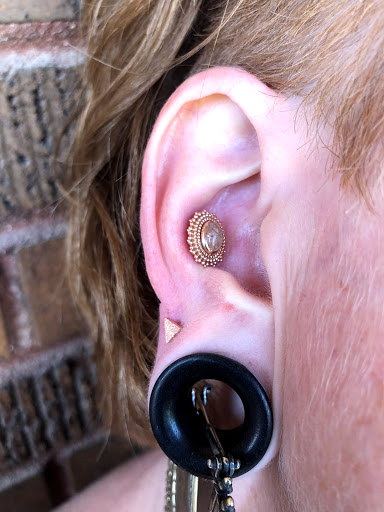 Explore cover up tattoo ideas on hip, creative tattoo ideas in Bloomington, available at Evil by the Needle Custom Tattoo and Piercing Studio