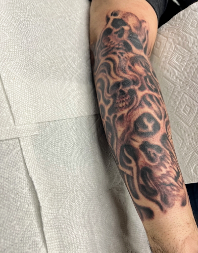 Explore tattoo ideas for back of hand, creative tattoo ideas in Georgetown, available at Iron Rite Tattoo South