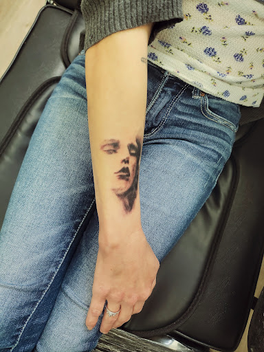 Explore angel neck tattoo ideas, creative tattoo ideas in Conway, available at Primal Urge Tattoos