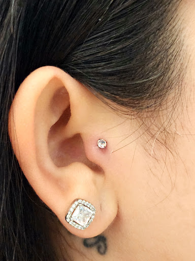 Explore flower wrist tattoo ideas, creative tattoo ideas in Marysville, available at Hawaiian Touch Piercing Co.