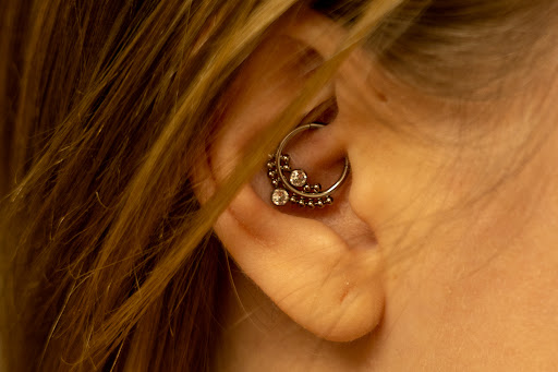 Explore floral tattoo cover up ideas, creative tattoo ideas in Des Moines, available at Axiom Body Piercing Studio