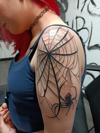 Explore batman sleeve tattoo ideas, creative tattoo ideas in Monticello, available at Saints Tattoos