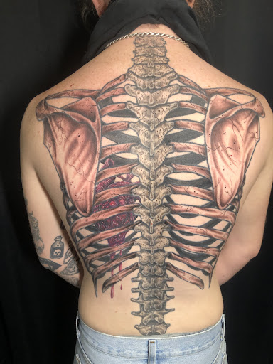 Explore small tattoo ideas for lower back, creative tattoo ideas in Englewood, available at Point of Entry Tattoo