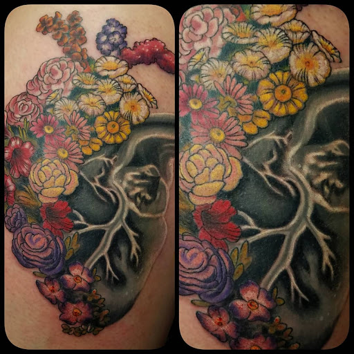 Explore tattoo ideas for stretch marks, creative tattoo ideas in Elizabeth City, available at Wolfs Den Custom Tattoo & Body Piercing Studio