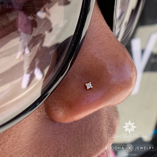 Explore campfire tattoo ideas, creative tattoo ideas in Akron, available at Lucid Body Piercing