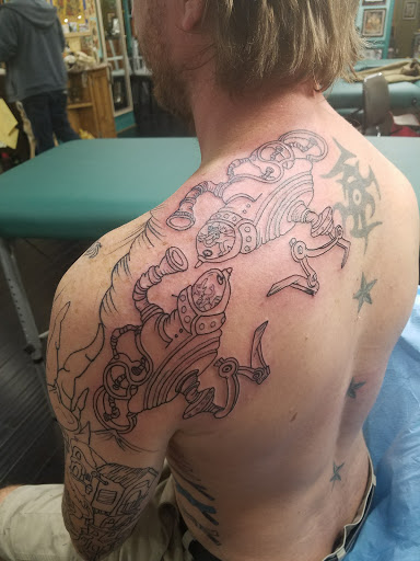 Explore tattoo ideas for men bicep, creative tattoo ideas in Jackson, available at Electric Dagger