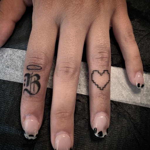 Explore cover up small tattoo ideas, creative tattoo ideas in Palm Harbor, available at Angry Owl Tattoo and Piercing