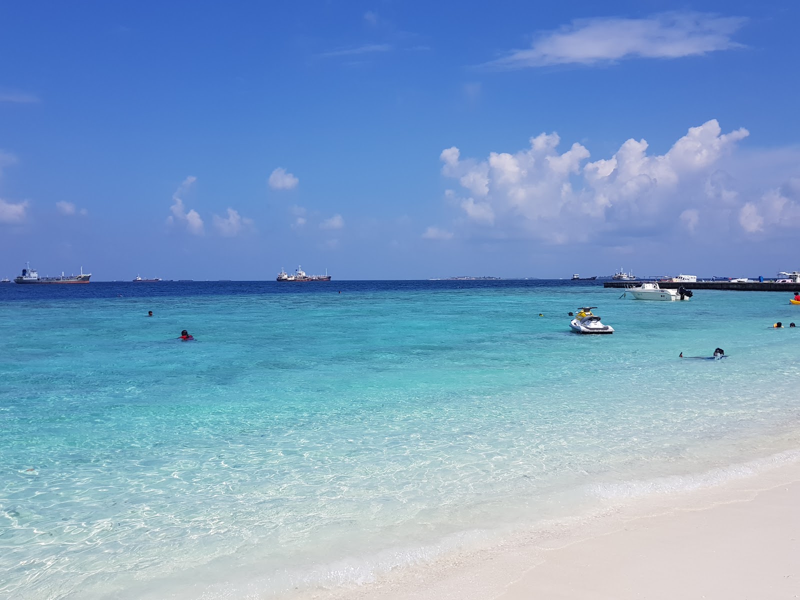 Photo of One Love Beach with turquoise pure water surface