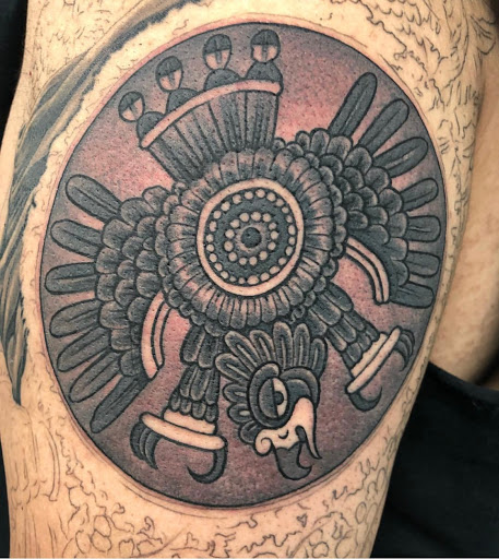 Find tattoo ideas for in between breast for your next unique tattoo in Warrenville at UpRise Tattoos