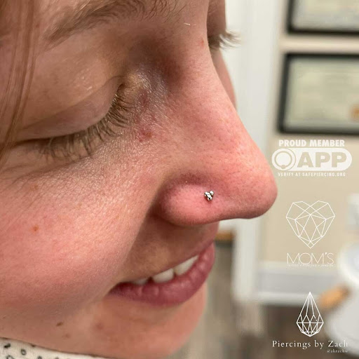 Explore to the moon and back tattoo ideas, creative tattoo ideas in Spokane, available at Moms Custom Tattoo & Body Piercing