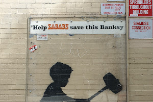Banksy "Hammer Boy" Mural