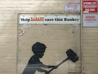 Banksy "Hammer Boy" Mural