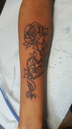 Explore small dinosaur tattoo ideas, creative tattoo ideas in Raleigh, available at Gifted Styles