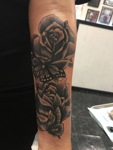 Explore paw print tattoo ideas, creative tattoo ideas in Rogers, available at Jimmy Romance Tattoo & Body Piercing