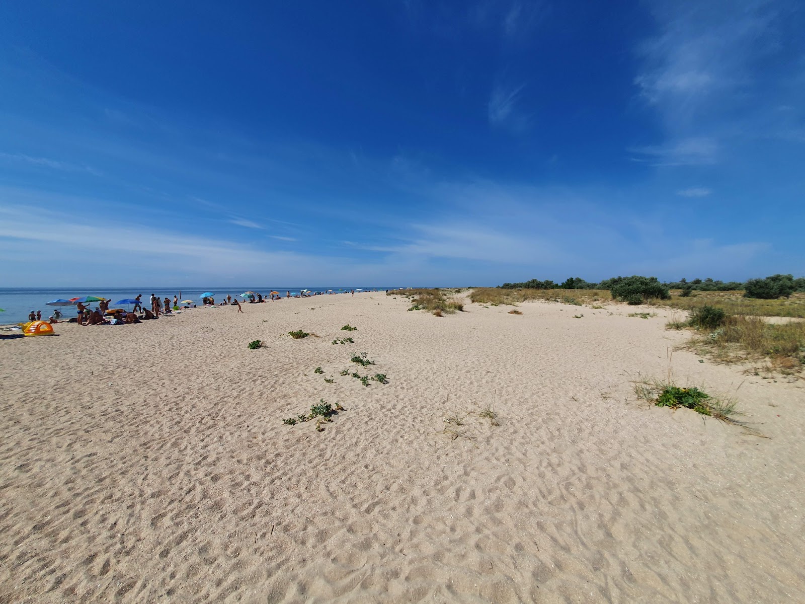 Foto av Dal'nya Kosa med lång rak strand