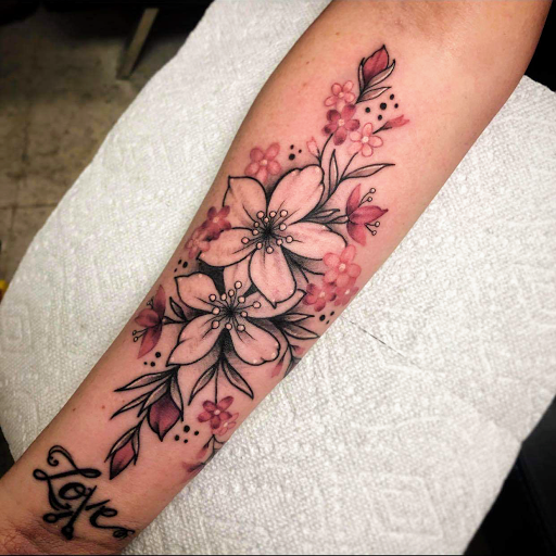 Explore color flower tattoo ideas, creative tattoo ideas in Burlington, available at Inferno Ink Tattoo & Body Piercing Studio