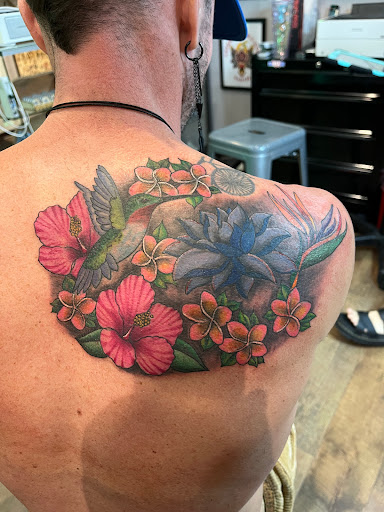 Explore shoulder flower tattoo ideas, creative tattoo ideas in Honolulu, available at Aloha Tattoo Waikiki Hilton Hawaiian Village Rainbow Bazaar