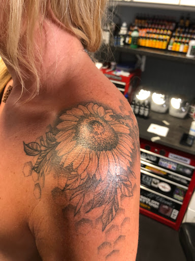 Explore womens tattoo ideas, creative tattoo ideas in Englewood, available at Point of Entry Tattoo