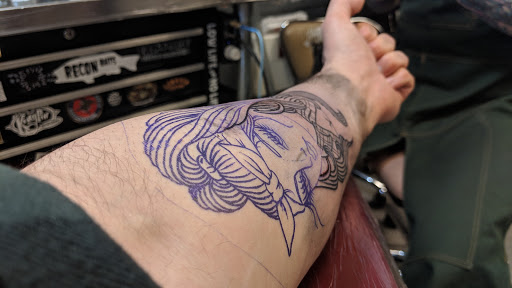 Explore tattoo ideas men, creative tattoo ideas in Orange, available at Black Palm Tattoo