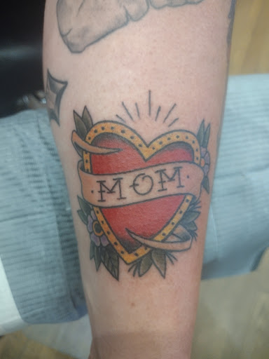 Explore wife name tattoo ideas on chest, creative tattoo ideas in Canton, available at The Inkeepers Tattoo Parlor